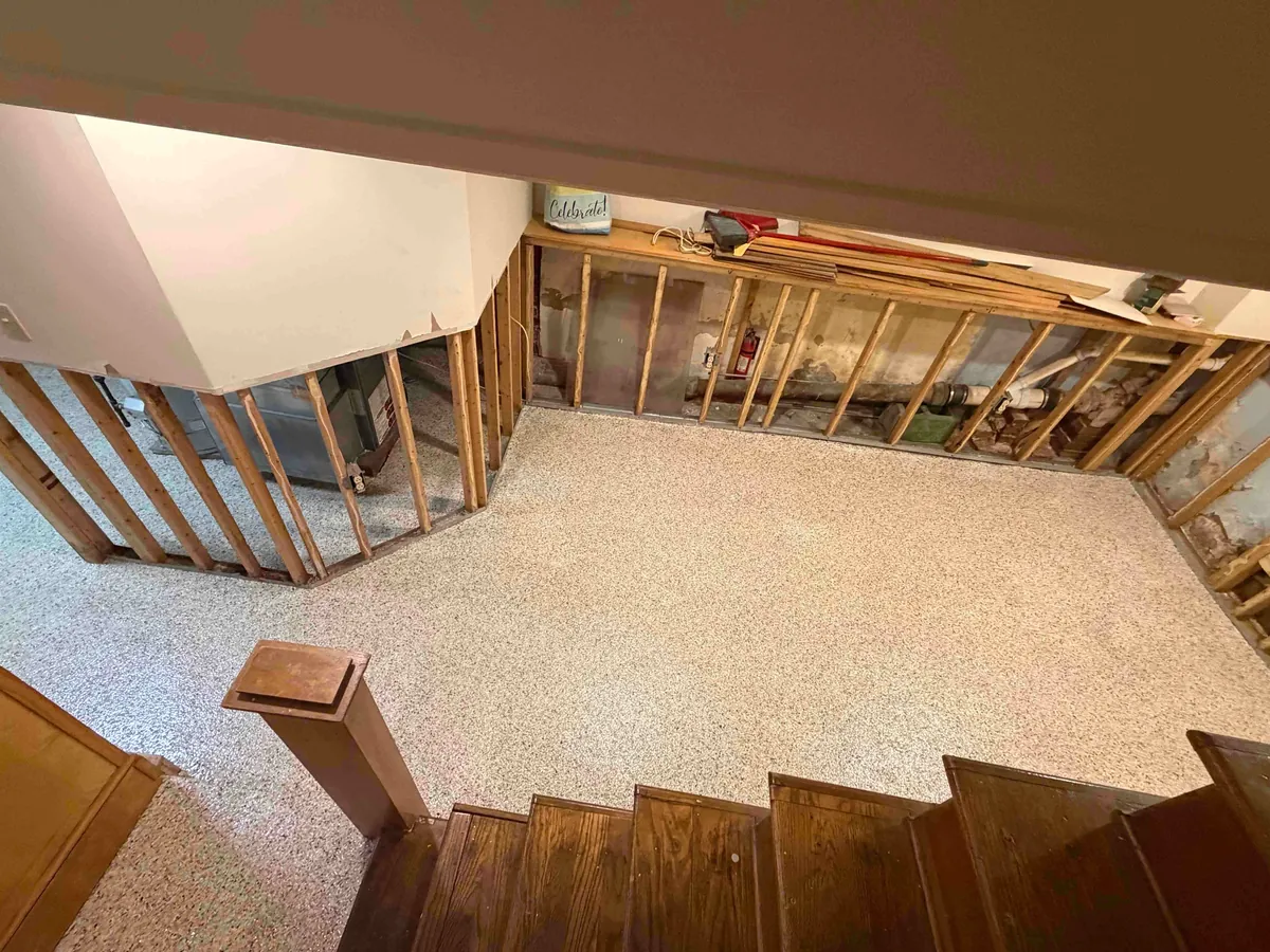 Basement floor finished with Shoreline flake epoxy, seen from the stairs