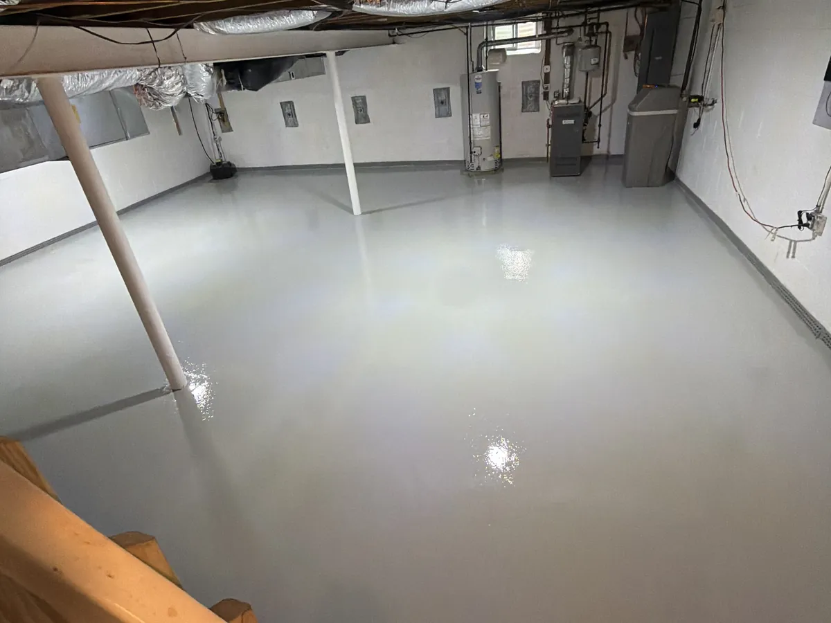 Basement floor finished in solid gray epoxy