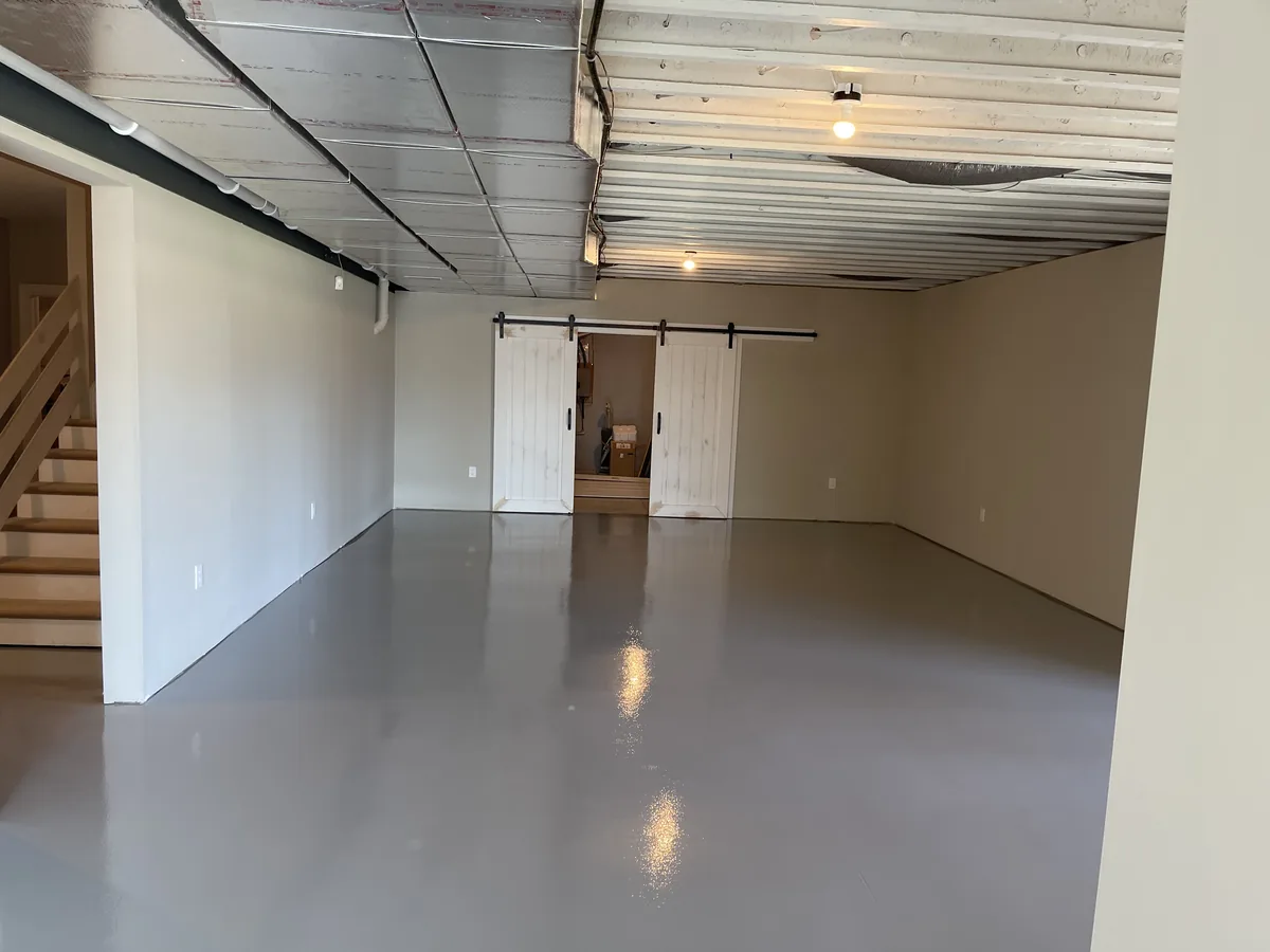 Concrete basement floor after a full-broadcast flake epoxy coating