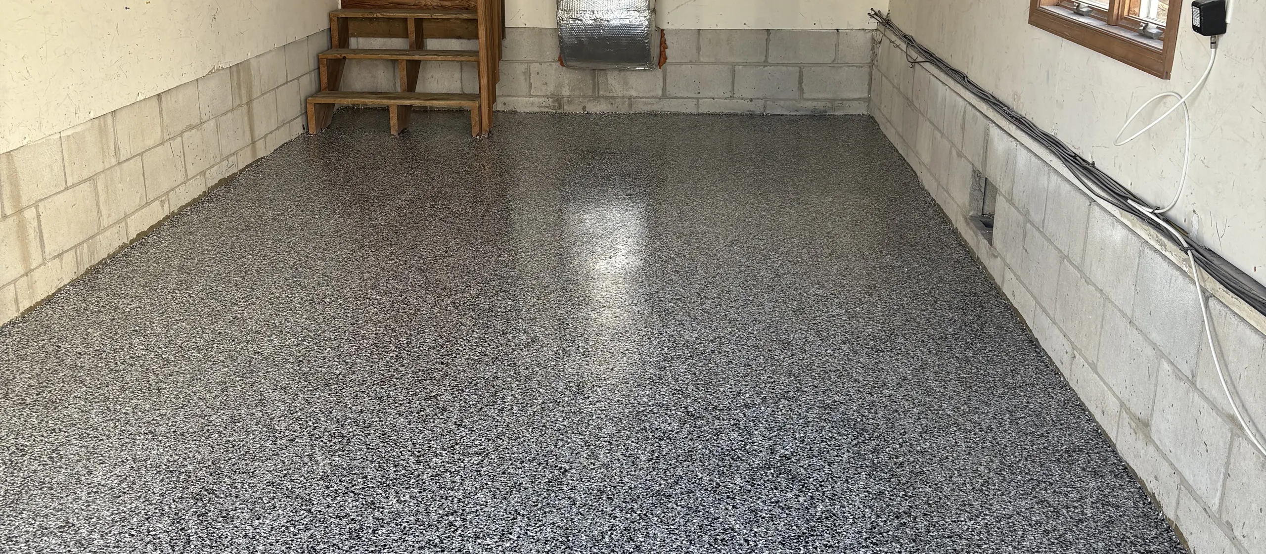 Domino flake epoxy garage floor by Liberty Epoxy