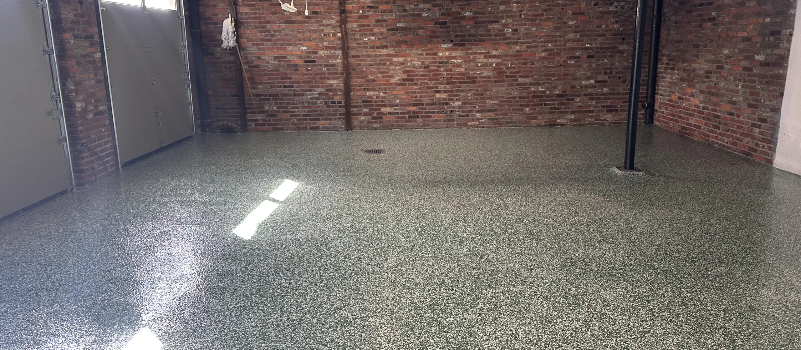 Finished flake epoxy garage floor by Liberty Epoxy