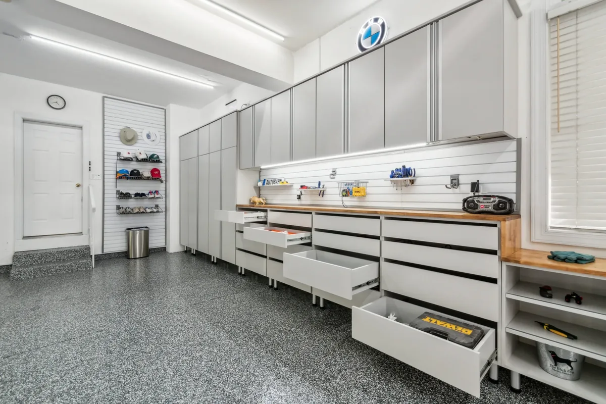 Flake epoxy garage floor with a workbench and shelving
