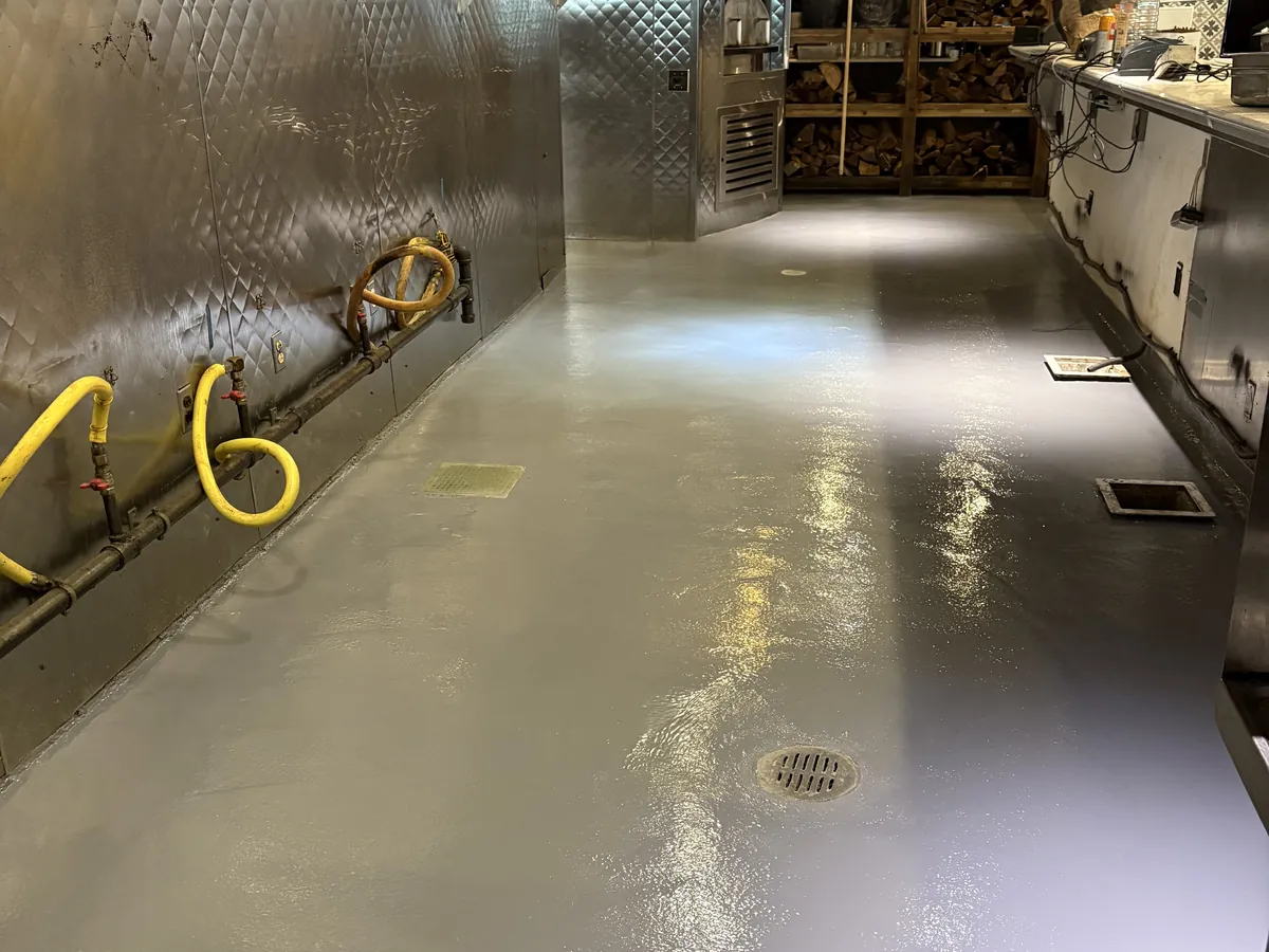 Coated commercial kitchen floor along a grill line