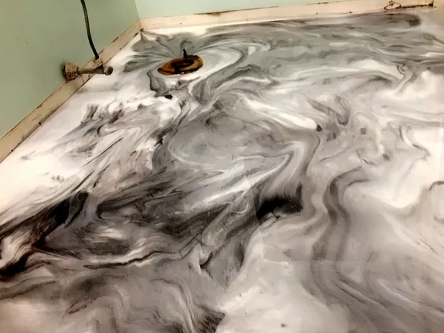 Black and white marbled metallic epoxy floor