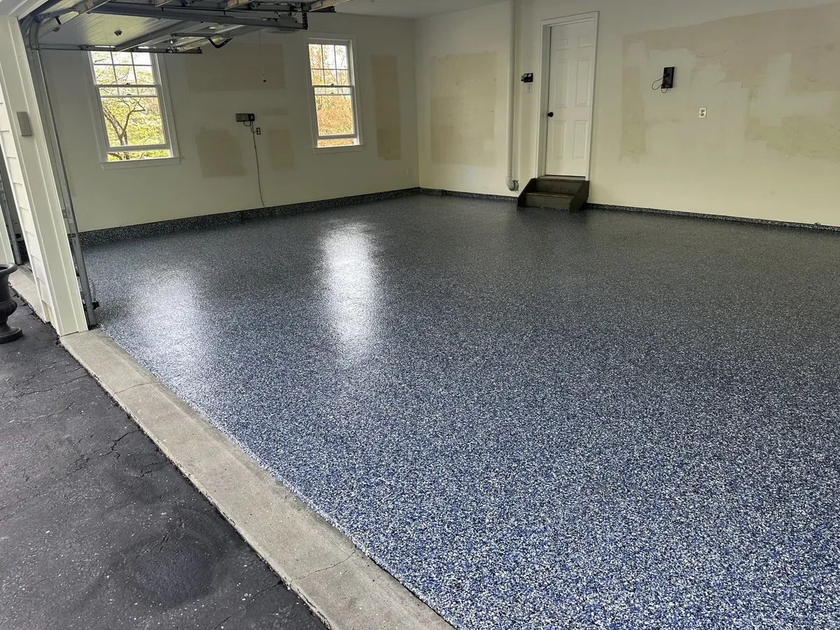 Orbit flake garage floor with coated stem walls and both doors open