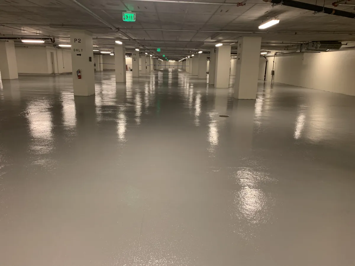 Solid color epoxy floor through a parking structure