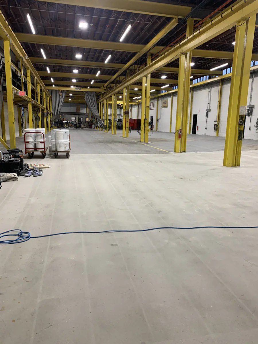 Same auto service shop floor before coating, bare concrete