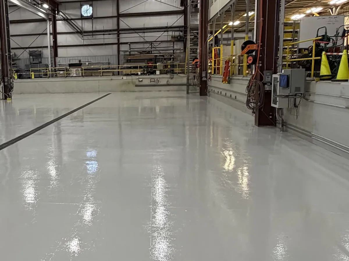 Solid color epoxy floor in a fabrication shop