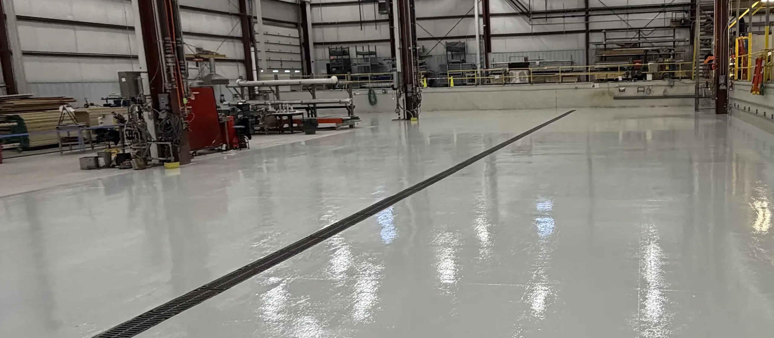 Light gray seamless epoxy floor in a manufacturing plant