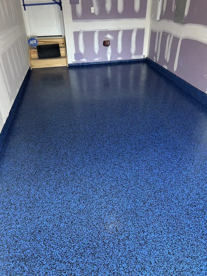 Custom blue flake epoxy floor installed by Liberty Epoxy