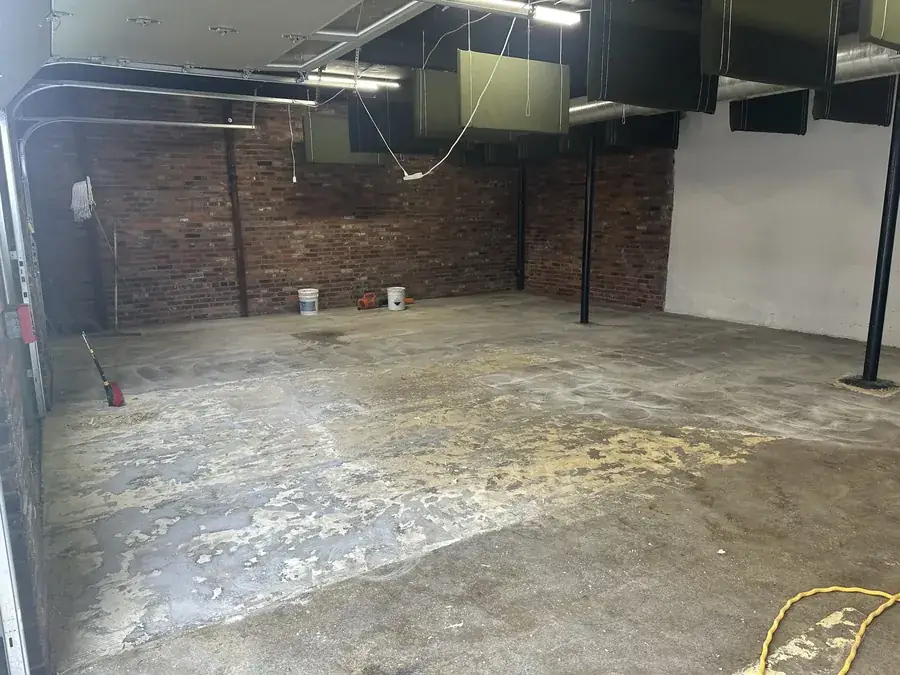 Garage floor before installation, bare concrete