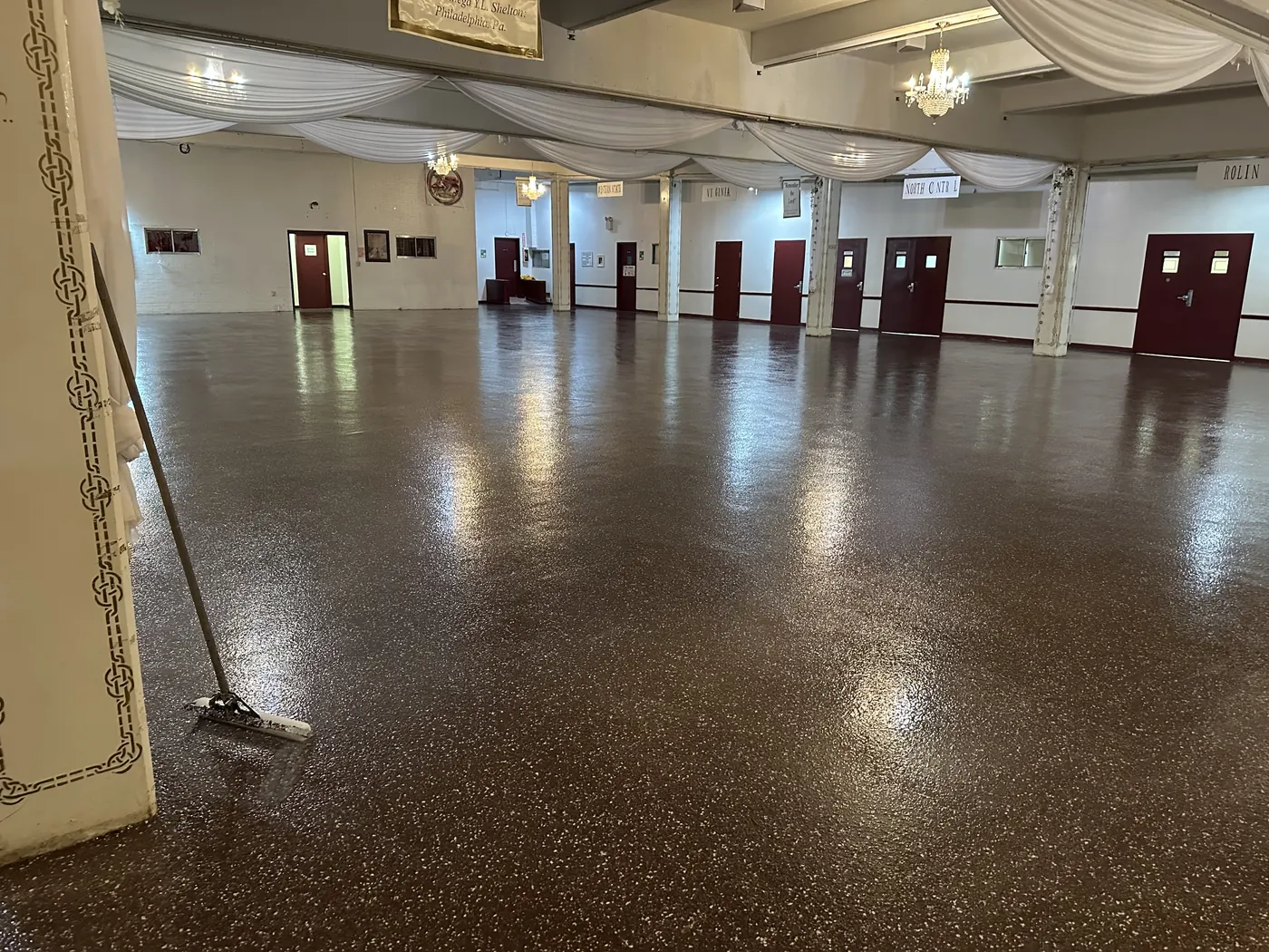 Event hall floor after brown flake epoxy system