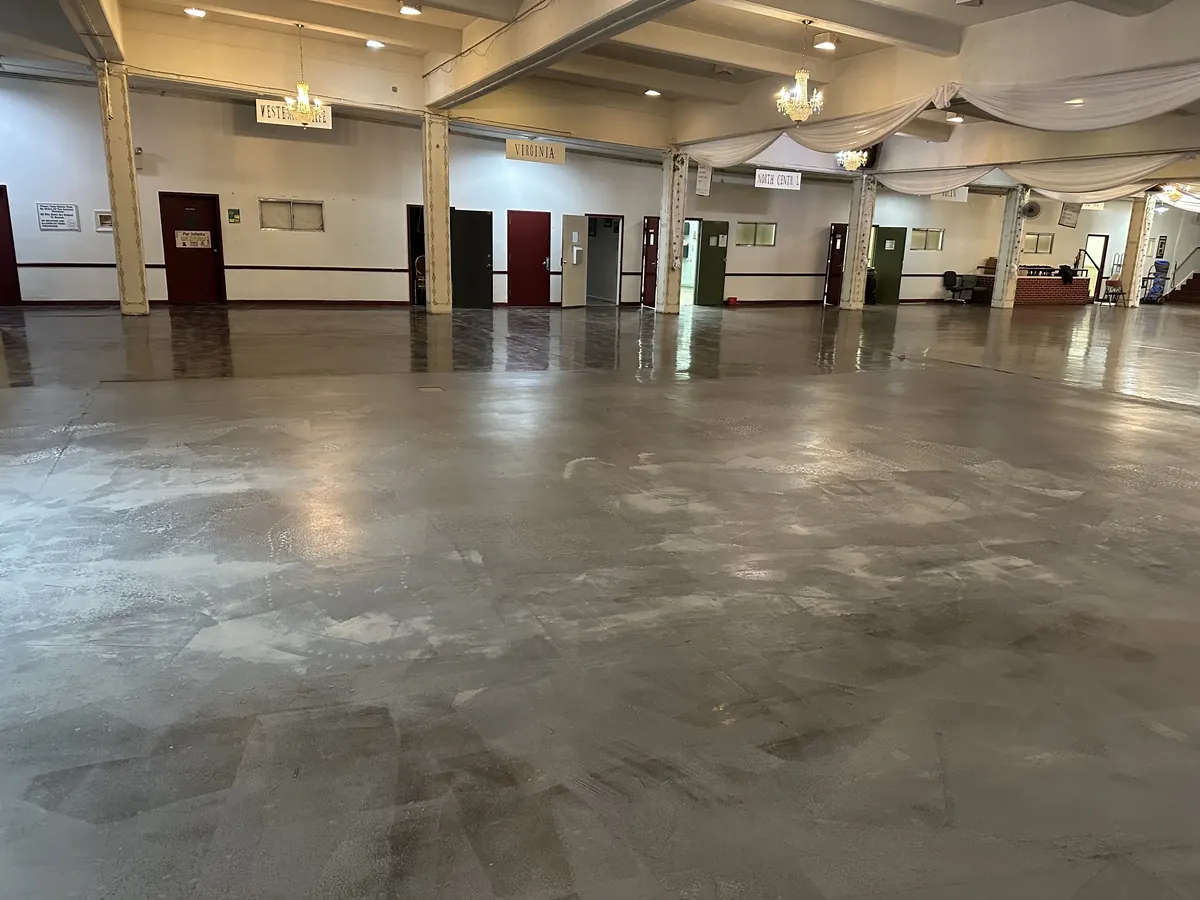 Event hall floor before coating, worn concrete