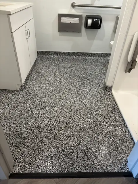 Flake epoxy floor in a commercial bathroom
