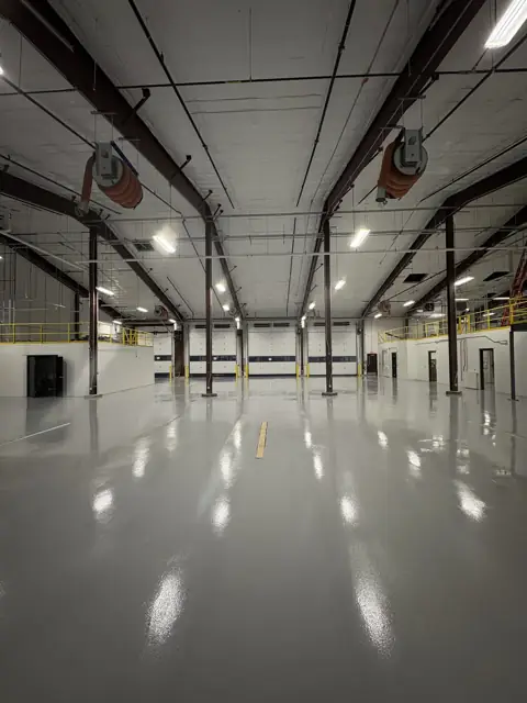 Solid color epoxy floor in a commercial vehicle bay