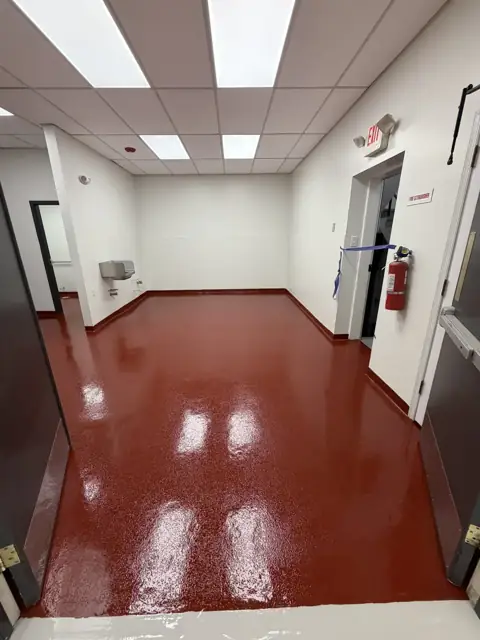 Tile red solid epoxy in a commercial utility room