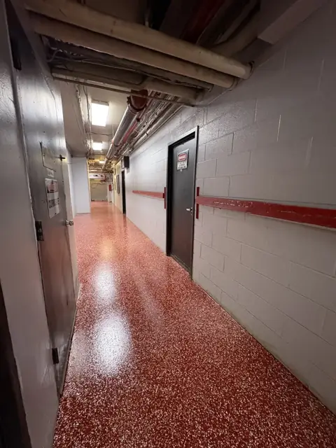 Red flake epoxy corridor in an industrial facility