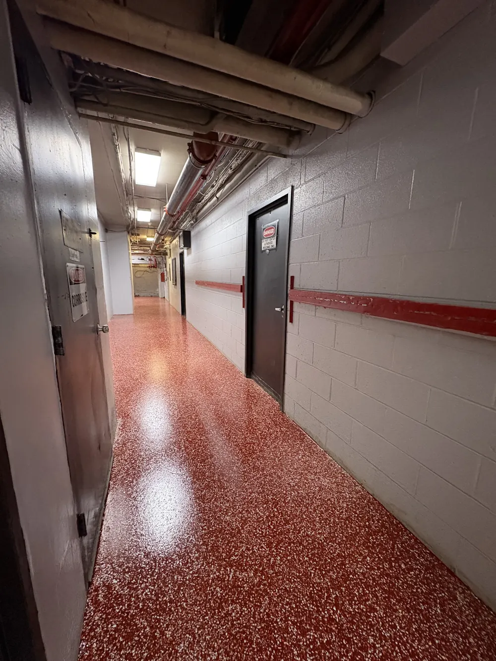 Red flake coated hallway floor in a commercial building