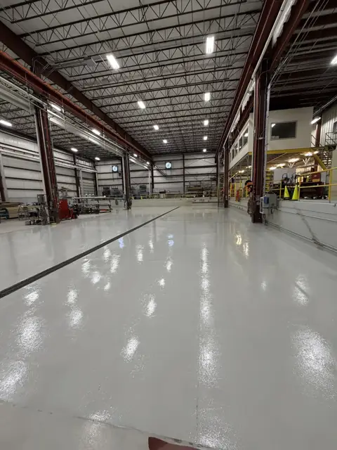 Solid color epoxy floor in a fabrication shop